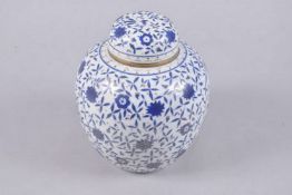 A EUROPEAN ISLAMIC MARKET PORCELAIN JAR AND COVER, 24cms high.