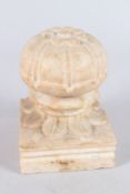 A LARGE 19TH CENTURY INDIAN CARVED MARBLE CARPET WEIGHT. 6ins high.