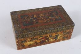 A 19TH CENTURY PERSIAN QAJAR PAINTING and a lacquered wooden box. 6.5ins long.