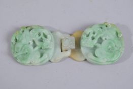 A FINE CHINESE CARVED JADEITE BELT BUCKLE, with chilong designs, 11cms wide (x 2 pieces).