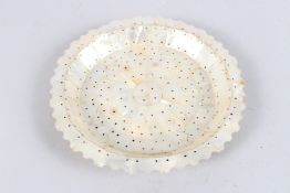 AN INDIAN GOA MOTHER-OF-PEARL PLATE. 8.5ins diameter.