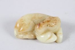 A CHINESE CARVED JADE SLEEPING HORSE. 8cms long.