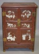 A VERY FINE CHINESE RED LACQUERED CABINET, with inlaid ivory figural decoration with birds and