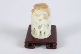 A RARE FINE 19TH CENTURY CHINESE JADE CARVING depicting birds and open foliage. 2ins high, on a