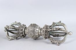 A LARGE WHITE METAL TIBETAN VAJRA. 21ins long.
