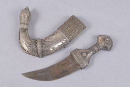 A LARGE OMANI WHITE METAL MOUNTED JAMBIYA, 38cms long.