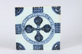 A TIBETAN BLUE AND WHITE TEMPLE TILE depicting VAJRA. 7.5ins x 7.5ins.