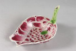 A CHINESE LOTUS FORM PORCELAIN WATER DROPPER, with calligraphic inscription to the stem, 18cms at