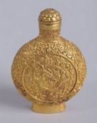 A CHINESE GILT BRONZE DRAGON SNUFF BOTTLE, 8cms high.
