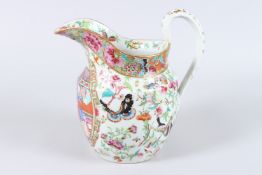 A 19TH CENTURY CHINESE CANTON PORCELAIN JUG, painted with a panel of figures in an interior, the