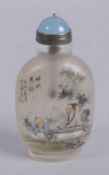 A CHINESE REVERSE GLASS PAINTED AND GOLD SPLASH SNUFF BOTTLE, 9.5cms high.