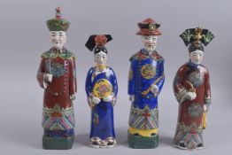A SET OF FOUR CHINESE PORCELAIN FIGURES, each with impressed marks to base, tallest 36.5cms high.