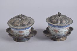 A PAIR OF 20TH CENTURY CHINESE METAL MOUNTED PORCELAIN CUPS AND COVERS, the base with six-
