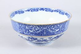 A JAPANESE BLUE AND WHITE PORCELAIN CIRCULAR BOWL, painted to the centre with a female figure and