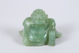 A CHINESE CARVED JADE SEATED BUDDHA. 2.25ins.