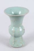 A CHINESE CELADON GLAZED YEN YEN SHAPE PORCELAIN VASE. 17.5cms high.