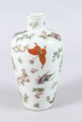 A CHINESE PORCELAIN VASE, painted with butterflies and flowers, red seal mask to base. 25cms high.