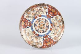 A LARGE JAPANESE IMARI PORCELAIN CHARGER, painted with panels of birds and trees within a stylised