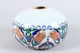A TURKISH OTTOMAN PORCELAIN CIRCULAR ARMENIAN HANGING BOWL with blue and red decoration. 8ins