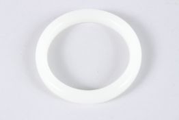 A CHINESE WHITE JADE BANGLE. 3.25ins diameter.