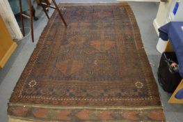 An old Persian rug, 276cm x 170cm.