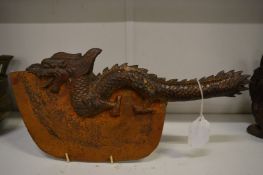 A Chinese bronze and steel axe modelled as a dragon.
