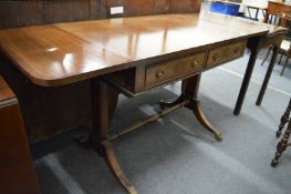 A reproduction mahogany sofa table.