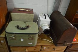 Various projectors and an old sewing machine.