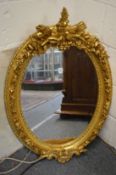 A good Victorian style gilt framed oval wall mirror.