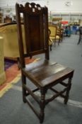 An early oak panel back occasional chair.