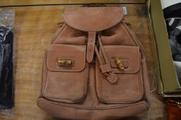 A brown leather ladies rucksack.