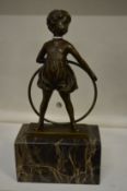 In the manner of Ferdinand Preiss, The Hoop Girl, bronze figure on marble base.