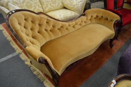 A good Victorian rosewood framed chaise longue with button upholstery.
