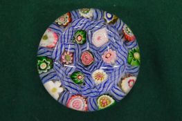 A millefiori glass paperweight.