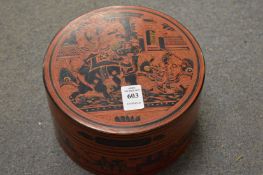 A Kashmiri circular red lacquer box with lift out tray.