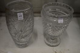 A large engraved glass vase together with a cut glass pedestal vase.