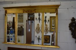 A Regency style gilt framed over-mantel mirror.
