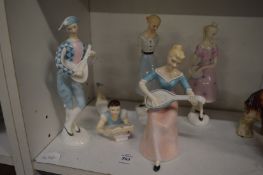 A group of five stylish Royal Doulton figurines.