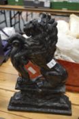 Painted cast iron door stop modelled as a lion rampant.