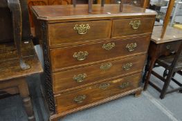 A George III mahogany chest of two short and three graduated long drawers on bracket feet with