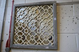 A pair of Moroccan style lattice work garden mirrors.