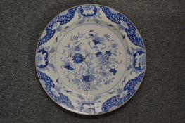 A large Chinese blue and white circular plate (faults).