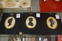 Three silhouette miniatures.