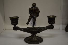 Bronze twin branch candelabra with figural mount.