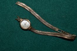 Ladies 9ct gold wristwatch with bracelet strap.