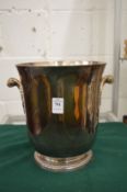 A silver plated twin handled wine cooler.