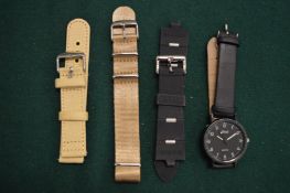 A gentlemans watch and watch straps.