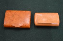 Two wooden snuff boxes.