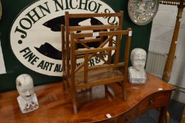 A mahogany magazine rack.