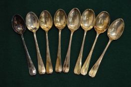 A set of eight silver coffee spoons.